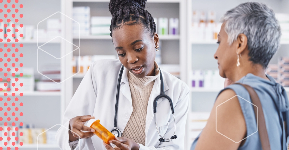 A young doctor converses with an older patient.